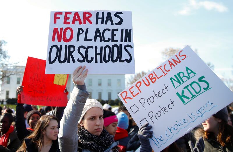 Students rally in front of the White House in Washington, Wednesday, March 14, 2018. Students walked out of school to protest gun violence in the biggest demonstration yet of the student activism that has emerged in response to last month's massacre of 17