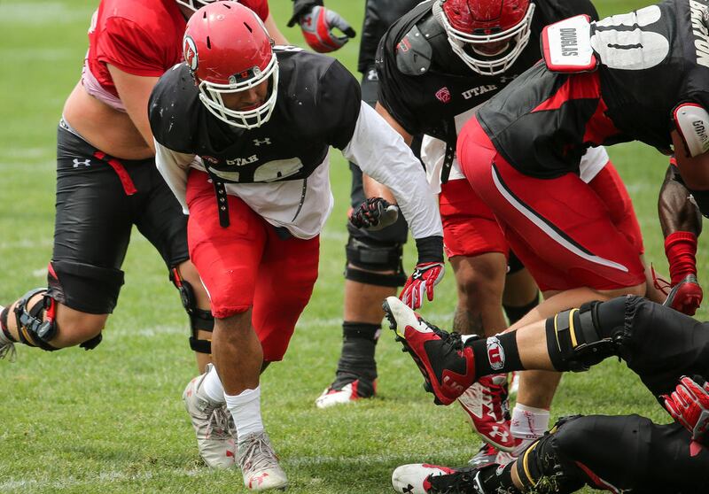 Linebacker Sunia Tauteoli, second from left, runs a drill during football practice at the University of Utah practice fields in Salt Lake City on Thursday, Aug. 18, 2016.