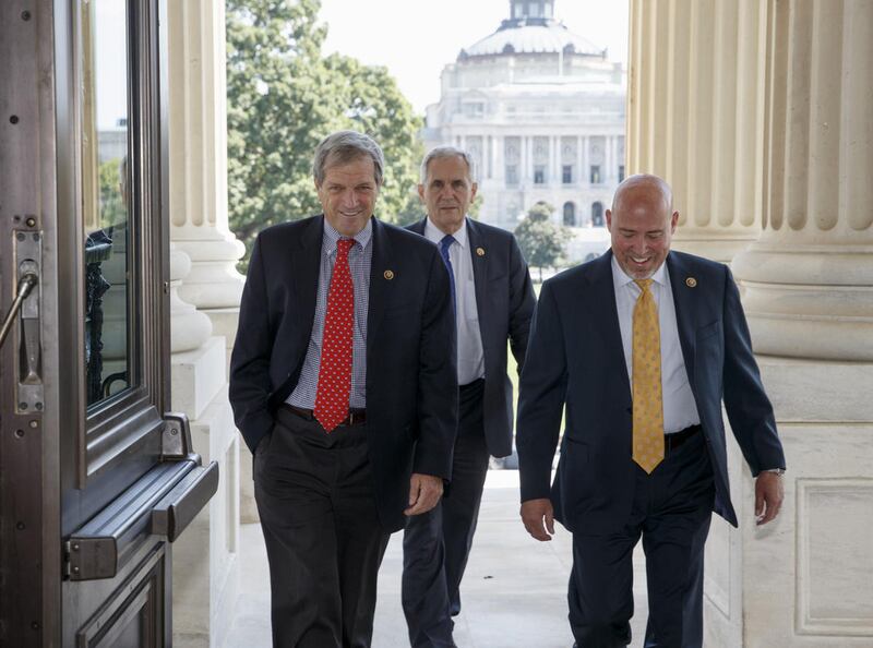 From left, Rep. Mark DeSaulnier D-Calif., Rep. Lloyd Doggett, D-Texas and Rep. Tom MacArthur R-N.J., arrive for a vote on Capitol Hill in Washington, Friday, Sept. 18, 2015, to block Planned Parenthood's federal funds for a year. The House used a nearly p