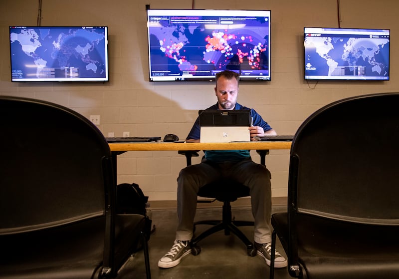 Nathan Meyer, who is in the cybersecurity certification program at Davis Technical College, works in the server room at the school's Kaysville campus on Wednesday, June 19, 2019.