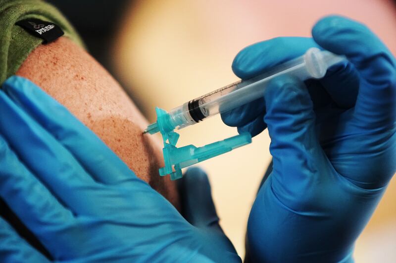 A COVID-19 vaccination is given at Utah Valley University in Orem on Thursday, Aug. 26, 2021.