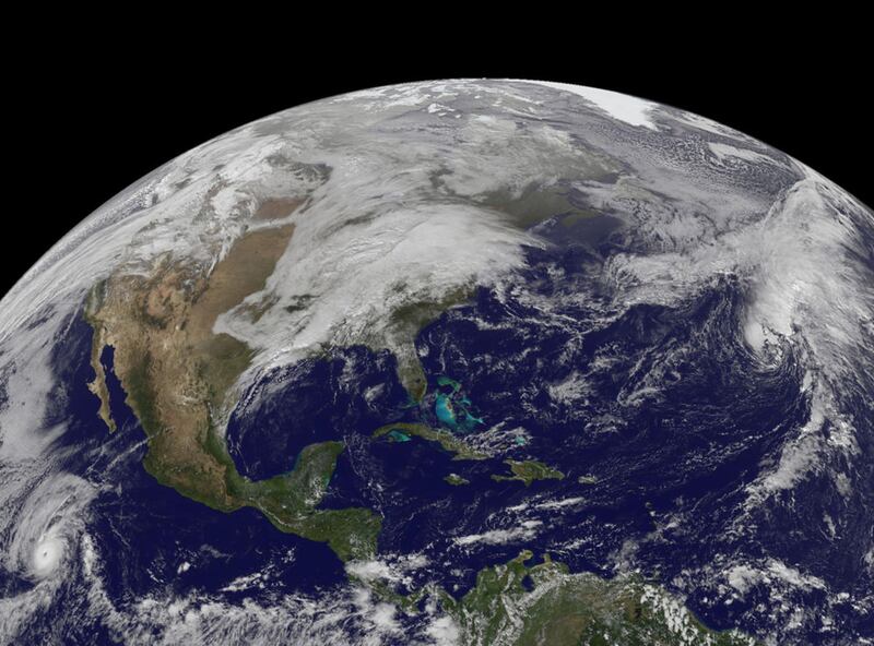 In an image from Nov. 22, when many people started traveling for Thanksgiving, cloud cover draped over the U.S. East Coast from a cold front that stretched from New England south into the Gulf of Mexico. On Nov. 23, that cold front still lingered although