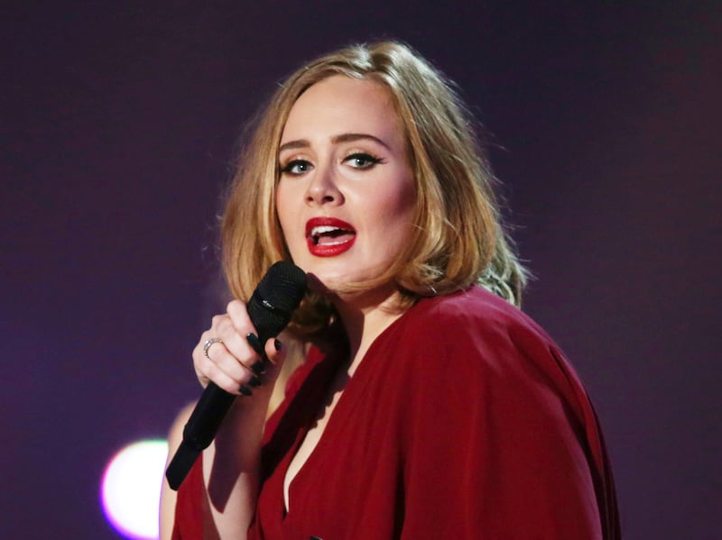In this Feb. 24, 2016 photo shows Adele onstage at the Brit Awards 2016 at the 02 Arena in London.