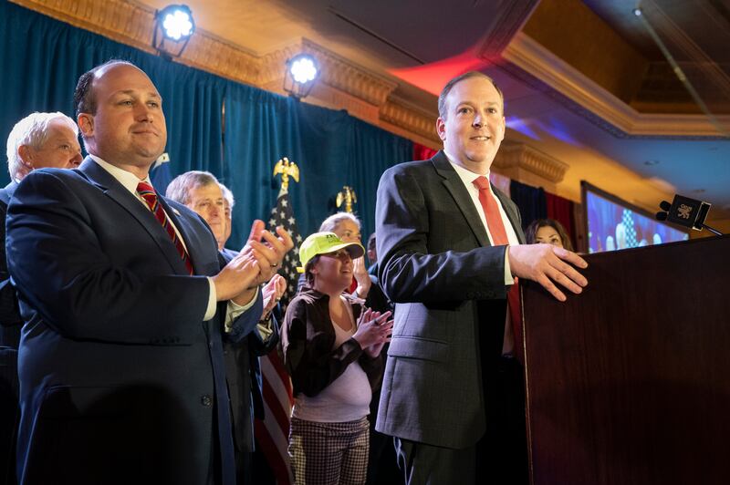 U.S. Rep. Lee Zeldin, right, smiles before speaking at the 2022 NYGOP Convention on Tuesday, March 1, 2022, in Garden City, N.Y.