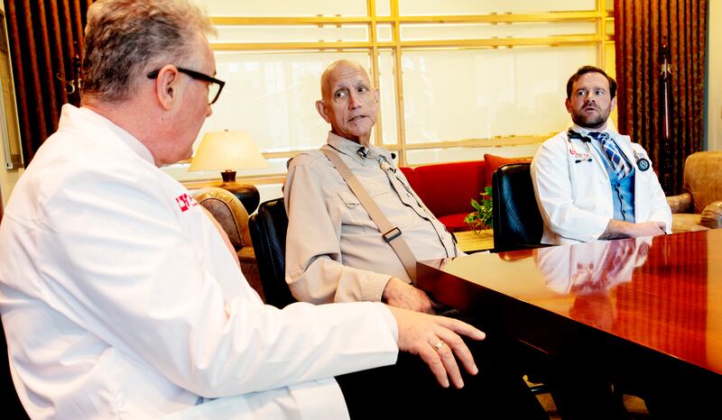 Martin McMahon, a cancer researcher at the Huntsman Cancer Institute and professor of dermatology at the University of Utah, left, Gordon Chamberlain and Chamberlain's doctor, Conan Kinsey, a physician-scientist at the institute, talk about a new treatmen