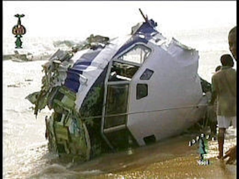 Cockpit of a Boeing 727 lies on Benin beach. The crash killed at least 82.