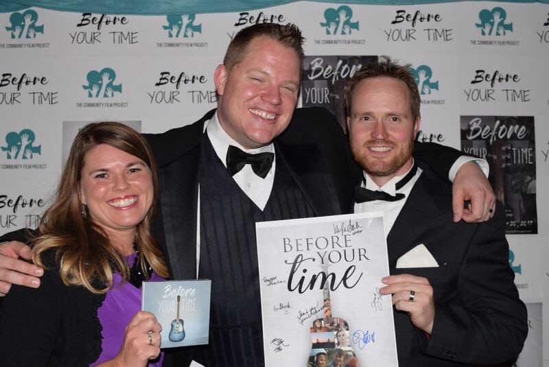 From left: "Before Your Time" composer Tawnya Goodson Shaner, director Lucas James McGraw and composer Phil Stokes hold a soundtrack and poster from the film.
