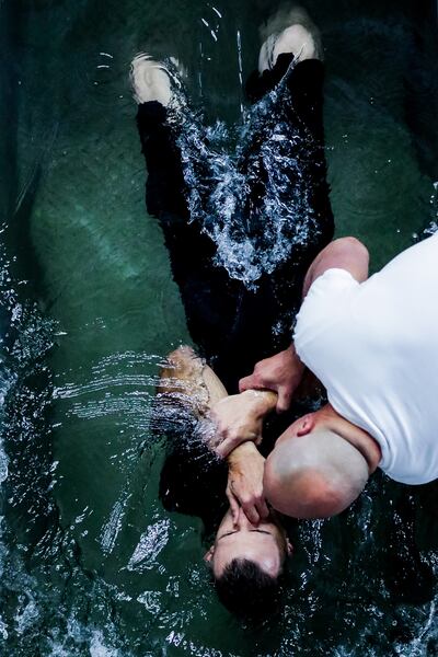 Nolan Curtis is baptized by Corey Van Buren, of Price, at the Jehovah's Witnesses convention at the Dee Events Center in Ogden on Saturday, July 6, 2019.