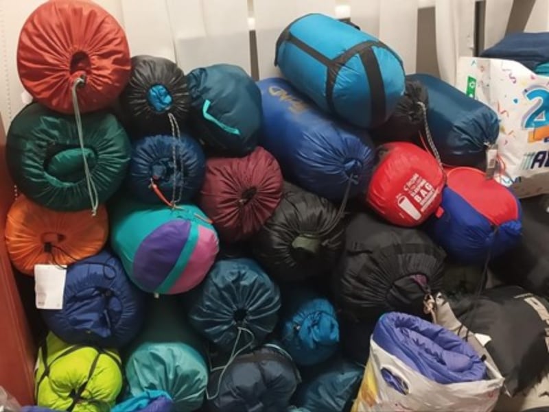 A pile of sleeping bags and other goods were brought from Sweden by two young men.