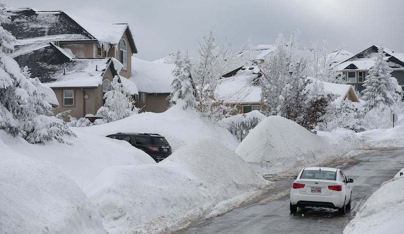 A motorist drives in the snow on Wednesday, Jan. 18, 2023.