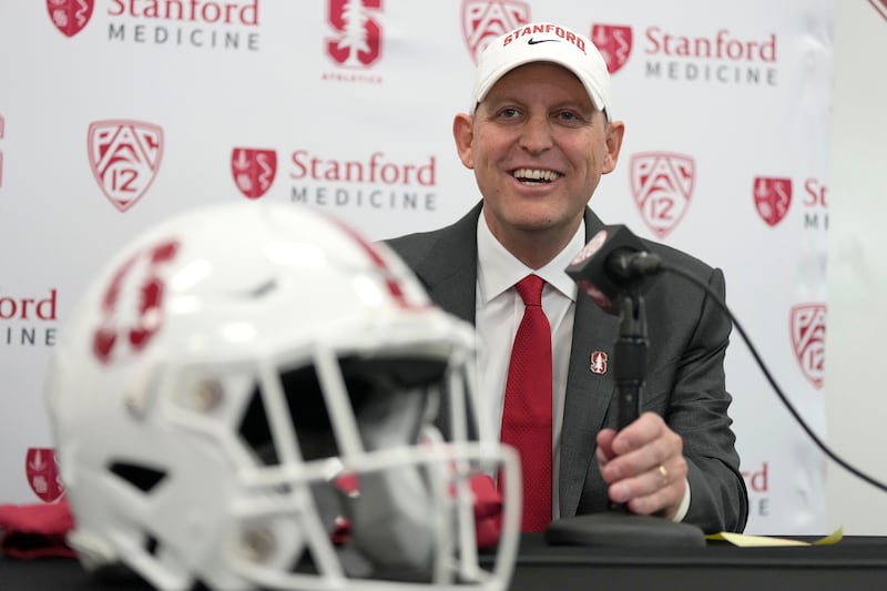 Troy Taylor smiles as he speaks after being introduced as the new head football coach at Stanford.