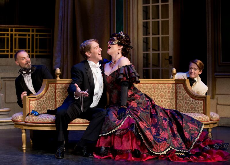 Troy Cook, left, as Dr. Falke, Daniel Belcher as Eisenstein, Sara Gartland as Rosalinde and Abigail Levis as Prince Orlofsky perform in a scene from Utah Opera's upcoming production, "Die Fledermaus," at the Capitol Theatre in Salt Lake City on Wednesday,