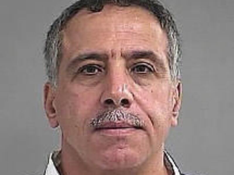 This photo provided by Louisville Metro Corrections shows Mahmoud Hindi. Police say a man shot and killed one person and critically injured another at a homeowners association meeting at an eastern Louisville church. Louisville police spokeswoman Alicia