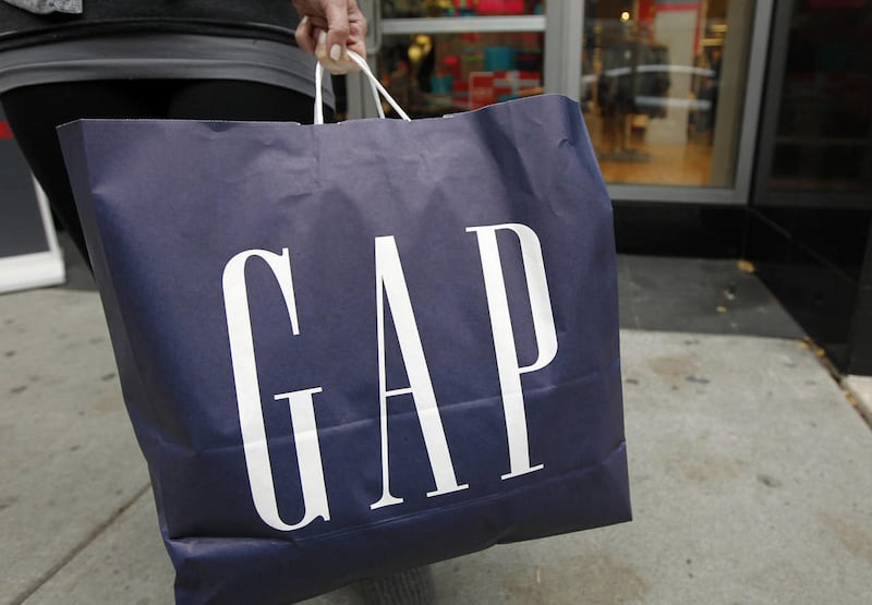 In this Nov. 15, 2011 photo, a woman pauses as she walks out of the Gap store, in Philadelphia.  An ad featuring a Sikh man was defaced with graffiti against Muslims — both inaccurate and inappropriate. Gap responded to outcry on social media.