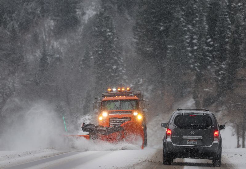 A snowplow clears the road in Big Cottonwood Canyon on Friday, Dec. 1, 2023.