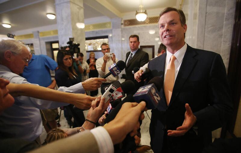 Utah Attorney General John Swallow speaks to the media after a Republican House Caucus meeting to discuss impeachment at the Capitol in Salt Lake City Wednesday, June 19, 2013.