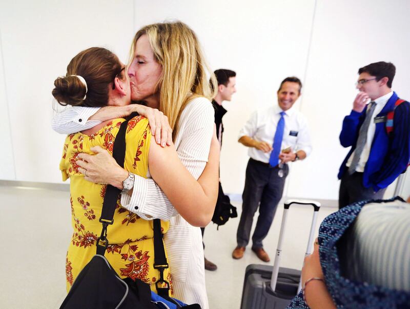 Sister Brenda Smart hugs and kisses Sister Rebecca Hoffman of Gilbert, Arizona, at the San Juan airport. Hoffman returned to Puerto Rico after the September 2017 hurricanes on Tuesday, Feb. 20, 2018.