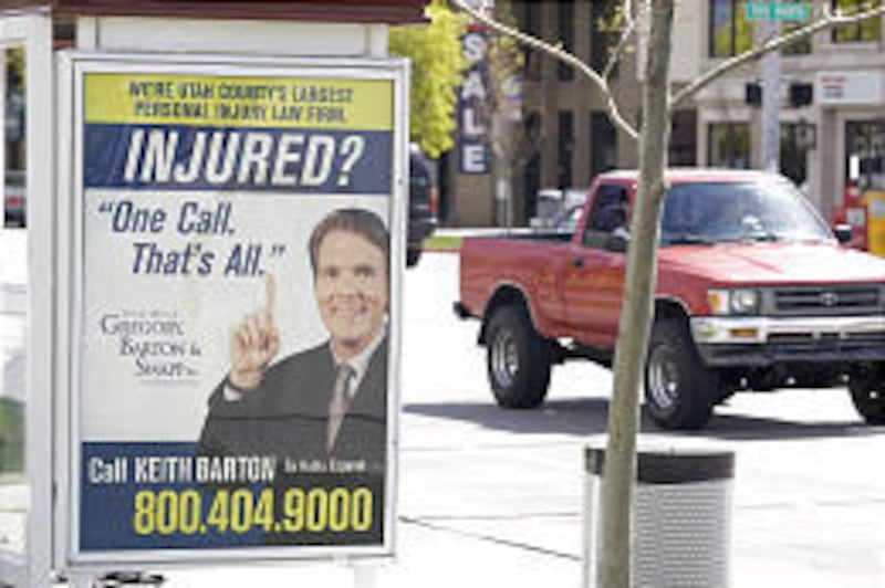A billboard in front of the Provo City Library touts the services of personal injury lawyer Keith Barton.