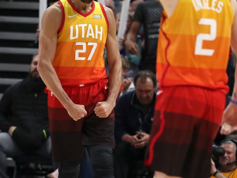 Utah Jazz center Rudy Gobert (27) flexes his muscles as Utah Jazz forward Joe Ingles (2) pumps his fists after Gorbert drove past Denver Nuggets forward Paul Millsap (4) for a basket during the Utah Jazz versus Denver Nuggets NBA game at the Vivint Smart