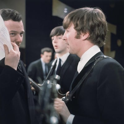 In the background is basist Paul McCartney.