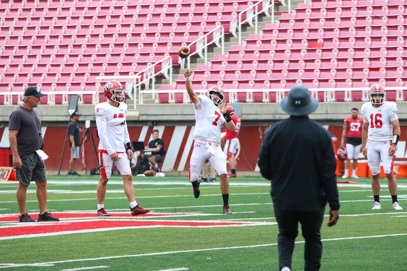 Baylor transfer Charlie Brewer, left, looks on as Cam Rising makes a throw during practice at Rice-Eccles Stadium.