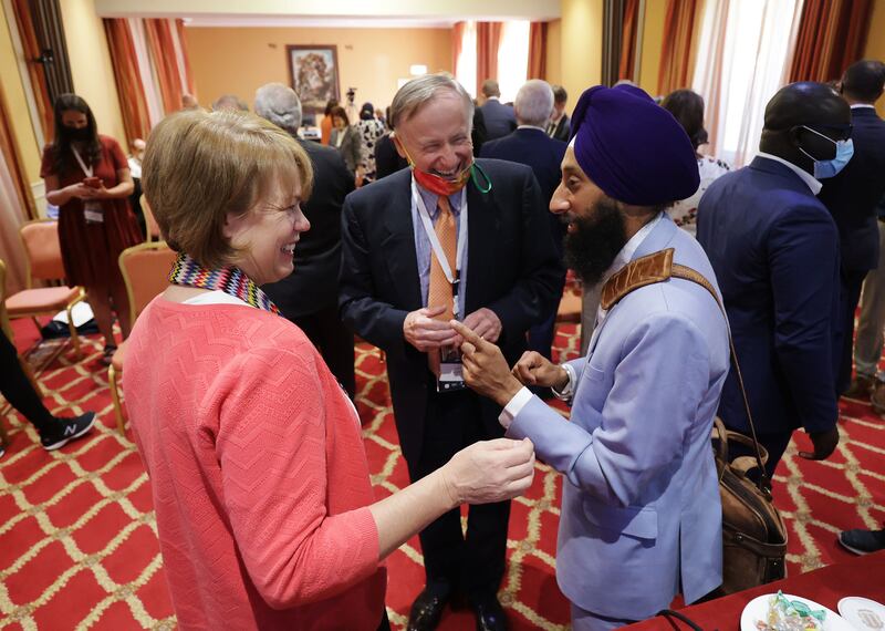 Sister Sharon Eubank, first counselor in The Church of Jesus Christ of Latter-day Saints’ Relief Society general presidency, left, chats with David Pollei, of the G20 Interfaith Forum Advisory Council, and Khushwant Singh.