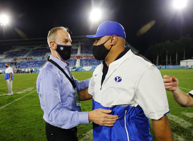 BYU athletic director Tom Holmoe is in the process of unwinding the Cougars’ future football schedules as the school prepares to join the Big 12 conference in 2023.