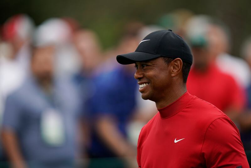 Tiger Woods smiles as he walks off the seventh tee during the final round for the Masters golf tournament, Sunday, April 14, 2019, in Augusta, Ga. (AP Photo/David J. Phillip)