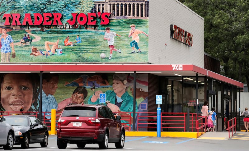 Customers walk to a Trader Joe’s market, Aug. 13, 2019, in Cambridge, Mass.