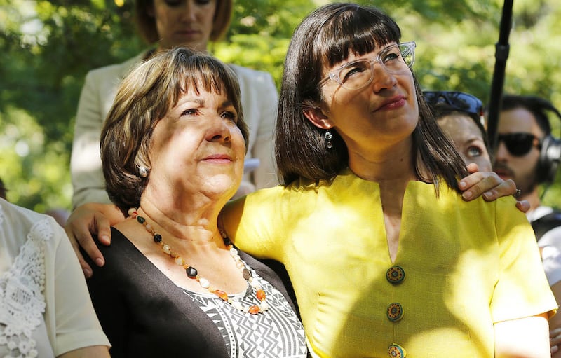 Kate Kelly, right, hugs her mother Donna during an Ordain Women rally in Salt Lake City Sunday, June 22, 2014. Kelly, leader of a group seeking women's ordination to the LDS priesthood, appealed her excommunication to her stake president in late July.