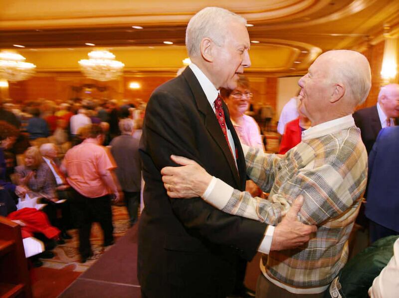 Orrin Hatch (L) talks with Scott Fisher at the 19th Annual Utah Conference for Seniors, April 18, 2006, at the Little America Hotel in Salt Lake City.
