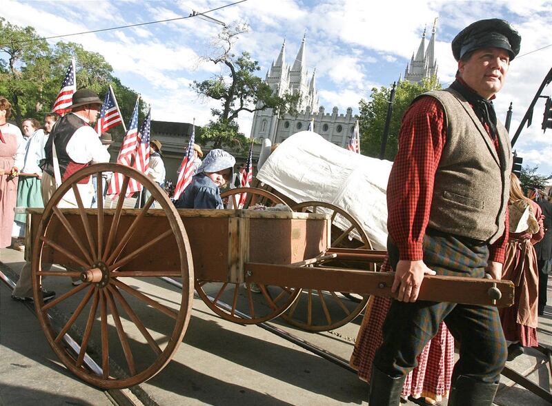 Steve Sorensen (cq) prepares to pull a handcart carrying Mary Gillmore (5) in the Days of '47 parade in Salt Lake City, Utah July 24, 2007. Photo by Keith Johnson