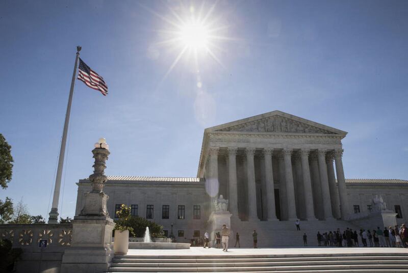 FILE - People visit the Supreme Court in Washington, Monday, June 26, 2017, as justices issued their final rulings for the term, in Washington.
