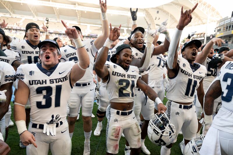 Utah State celebrates after defeating San Diego State for the Mountain West Conference Championship on Dec. 4, 2021.