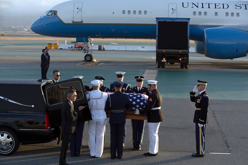 Members of an armed forces color guard carry the casket containing the body of U.S. Sen. Dianne Feinstein at San Francisco International Airport.