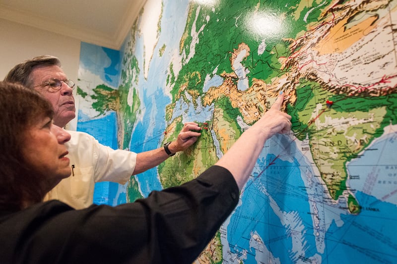 FILE - Carol, left, and Ed Diener discussing where Ed has collected data on happy families from around the globe in Salt Lake City, Utah on Monday, Aug. 28, 2017. Ed Diener is a research psychologist and Carol is clinical psychologist and they have applie
