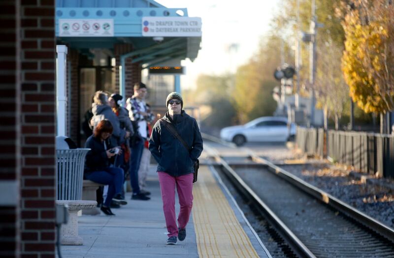 Rob Weidmann waits for TRAX on his morning commute to work, which includes using bus, TRAX and FrontRunner to get from Salt Lake City to Lehi, on Thursday, Nov. 8, 2018.