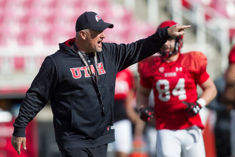 Utah football coach Kyle Whittingham instructs his team during practice at Rice-Eccles Stadium in Salt Lake City on Friday, March 30, 2018. All four of the major publications — Phil Steele's College Football Preview, Athlon, Lindy’s and Street & Smith’s —