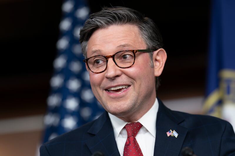 Speaker of the House Mike Johnson talks with reporters at the Capitol in Washington.