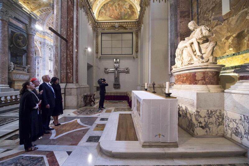 President Donald Trump and his wife Melania looks at Michelangelo's Pieta', during their visit to St. Peter's Basilica at the Vatican, Wednesday, May 24, 2017.