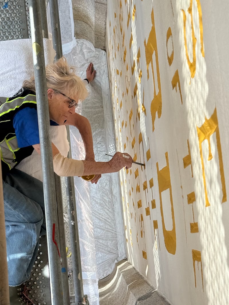 Restoration work underway on the "Holiness to the Lord" panel on the Salt Lake Temple on Tuesday, July 22, 2025.