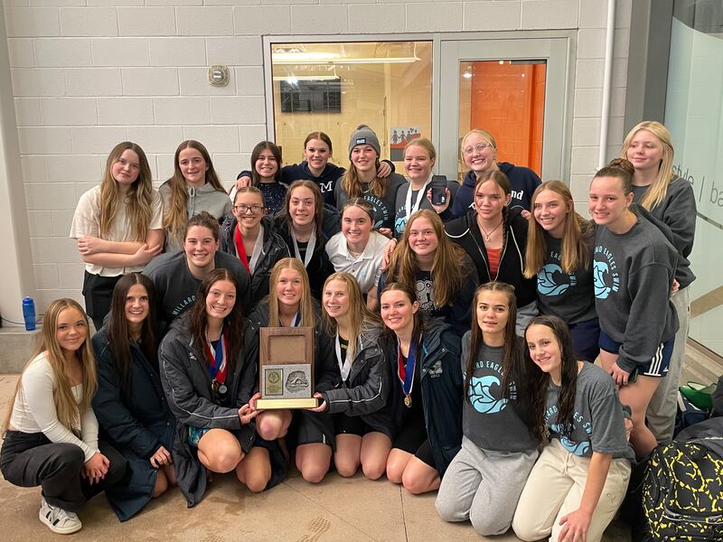 Members of the Millard High girls swim team pose for a picture after claiming the Region 2 title.