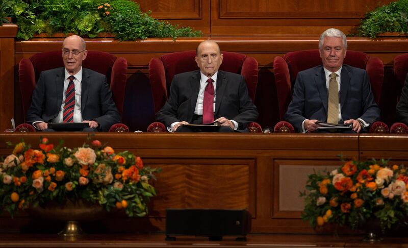 FILE - President Thomas S. Monson sits with his counselors President Henry B. Eyring First Counselor First Presidency and President Dieter F. Uchtdorf, Second Counselor in the First Presidency at the beginning of the Sunday morning session of the 186th Se