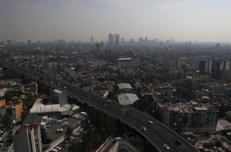 Smog blankets the sky in Mexico City, on Tuesday, May 21, 2019. The city was enveloped in pollution that is common for that time of year, before the summer rainy season, according to reports.
