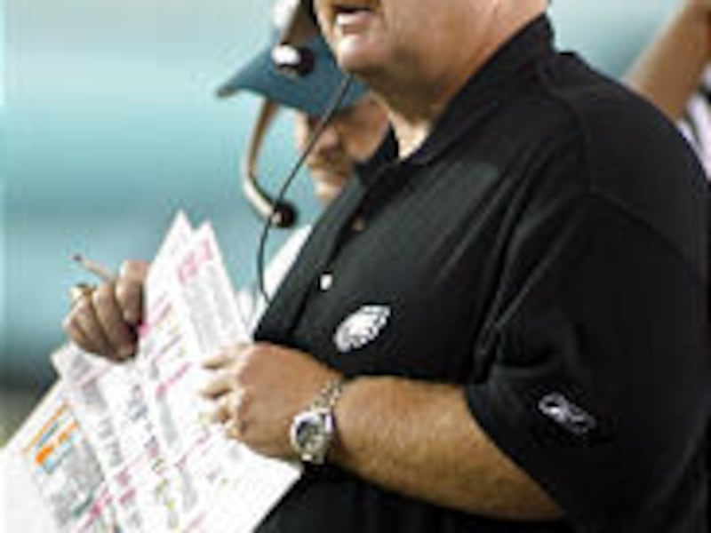 Philadelphia Eagles coach Andy Reid, here coaching against the Buccaneers, is taking heat for his offensive calls in Monday's shutout loss.