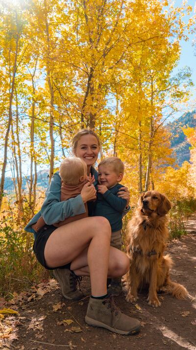 Hailey is pictured on a hike with her two children and pet dog
