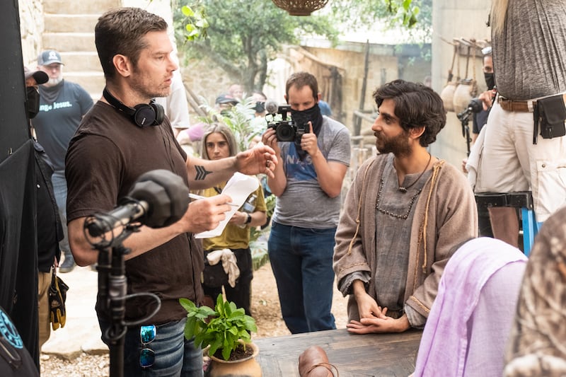 Left, Dallas Jenkins, creator and director of “The Chosen,” talks with actor Luke Dimyan, who plays Judas, while filming a scene from Season 3.