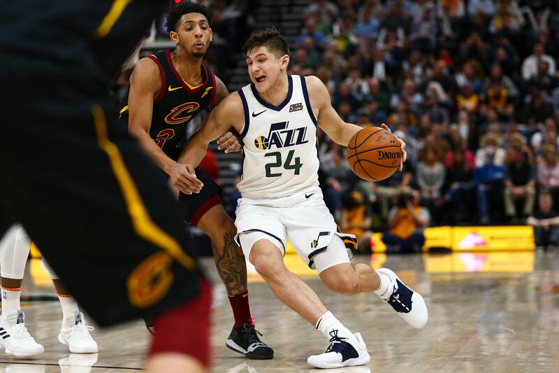 Utah Jazz guard Grayson Allen (24) dribbles to the hoop with the ball while guarded by Cleveland Cavaliers guard Cameron Payne (3) during the second half of the game at the Vivint Smart Home Arena in Salt Lake City on Friday, Jan. 18, 2019.