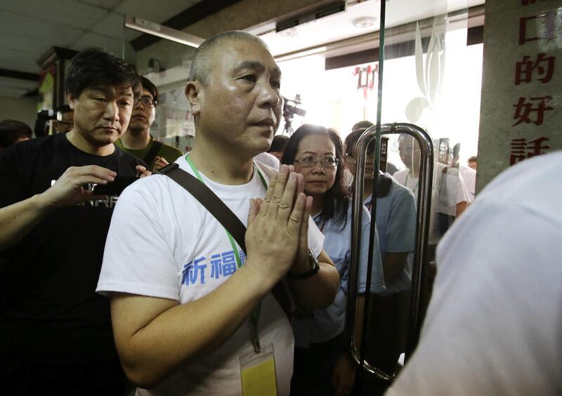 Chinese relatives of passengers on board the missing Malaysia Airlines Flight 370 arrive to pray at a Buddhist temple in Petaling Jaya, Malaysia, Monday, March 31, 2014.