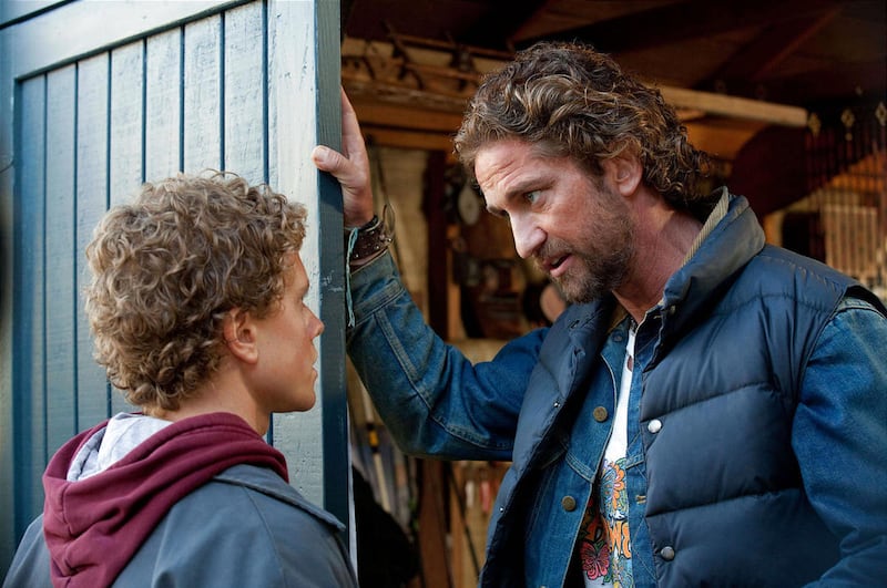 CHASING MAVERICKS Frosty Hesson (Gerard Butler) offers some sage advice to Jay Moriarity (Jonny Weston) about surfing ? and life. Photo credit: John P. Johnson. TM & ? 2012 Twentieth Century Fox Film Corporation and Walden Media, LLC. All Rights Rese